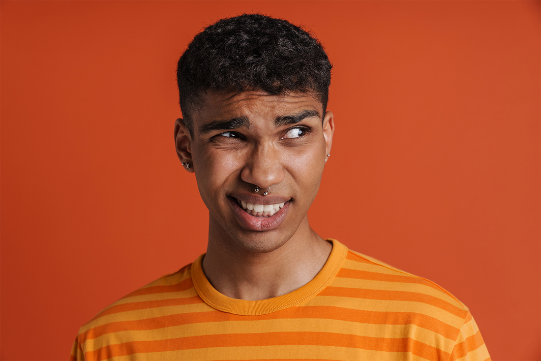 confused guy with piercings
