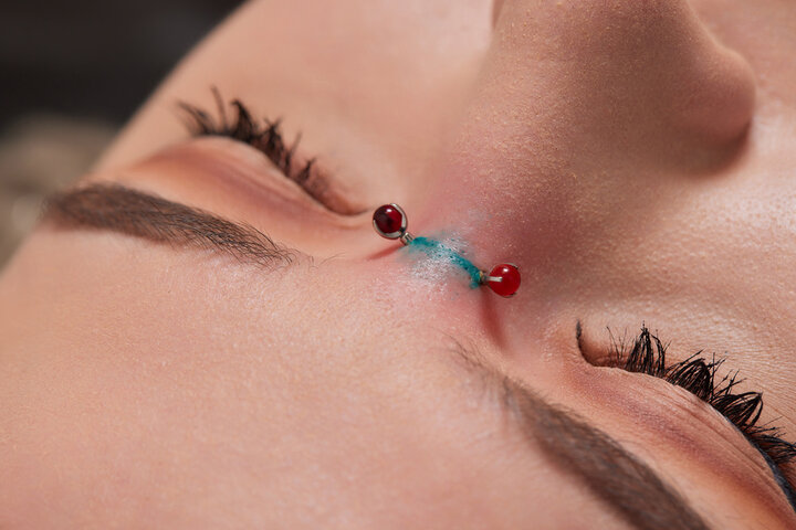 girl with nose bridge piercing