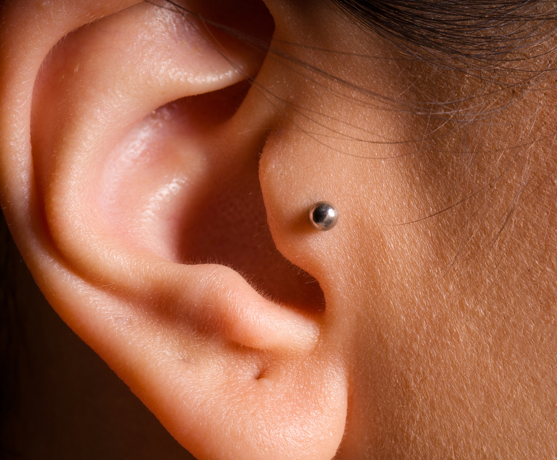 side view of ear with tragus piercing