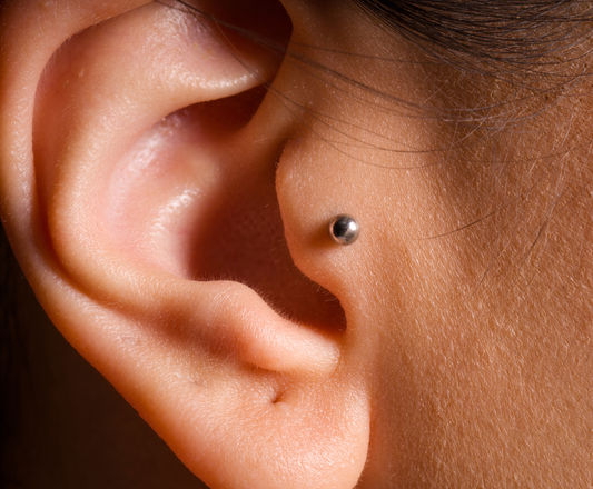 side view of ear with tragus piercing